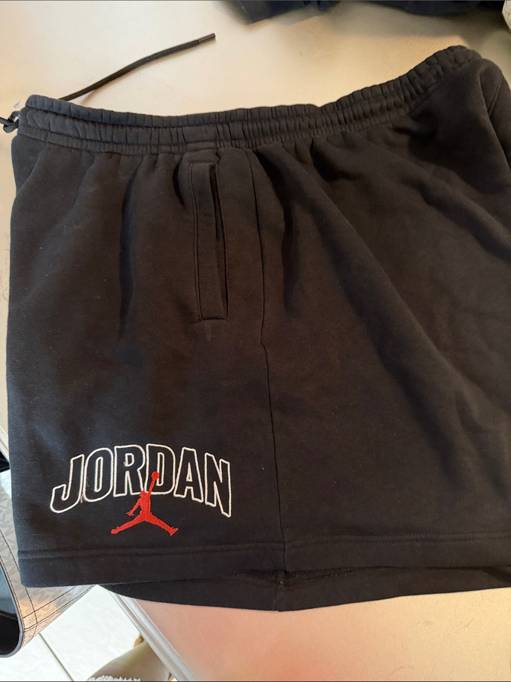 Jordan Black Athletic Shorts with Red Jumpman and White Outline